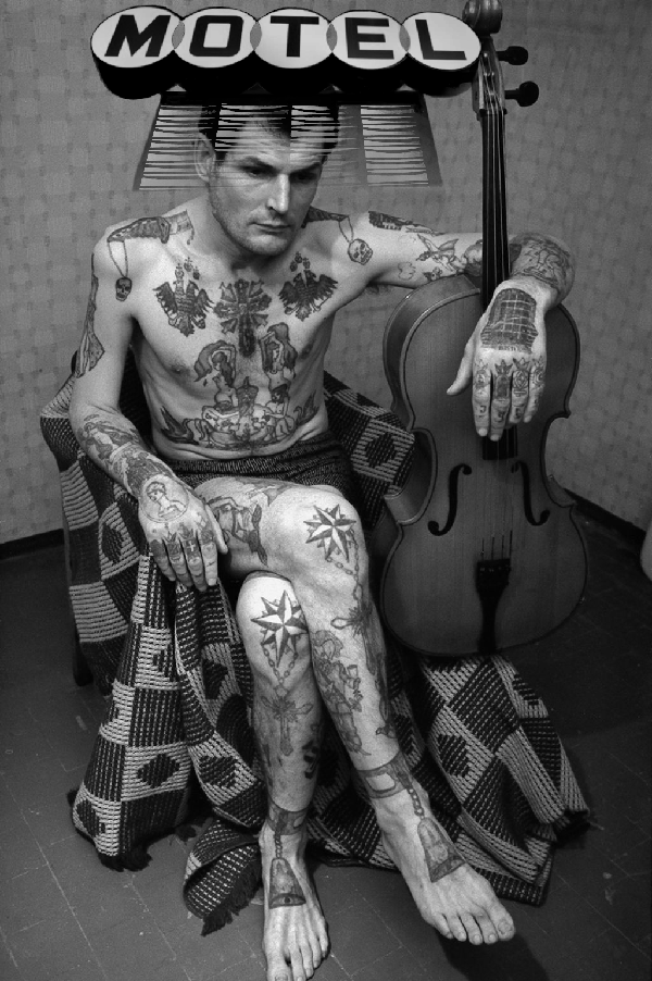 Downcast Inmate with Disgraced Tattoos in Protective Housing