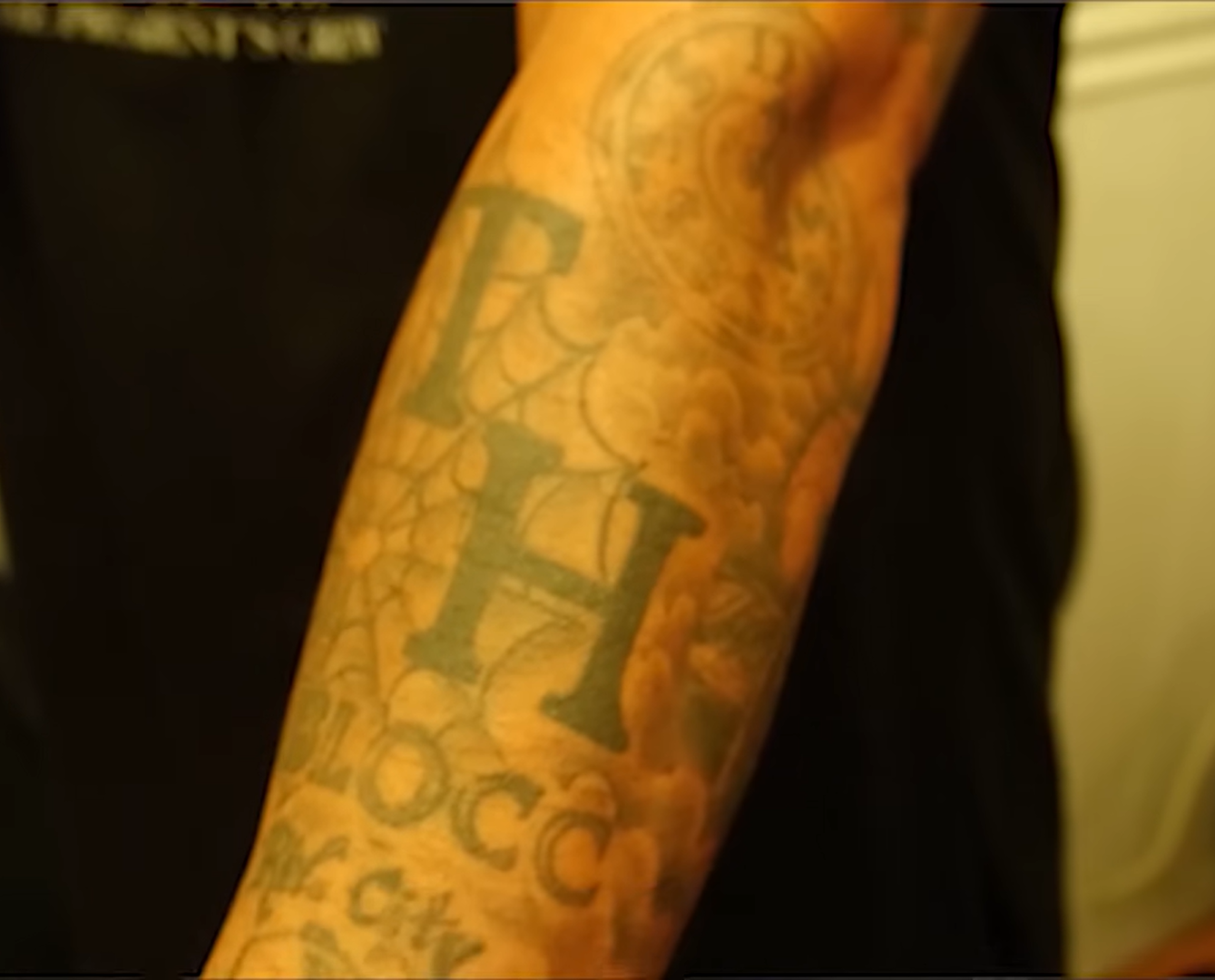 A machined Crip tattoo I did in 1990 with my two initials 'TH', a Navy spider web, 'BLOCC', and 'BIG CITY'